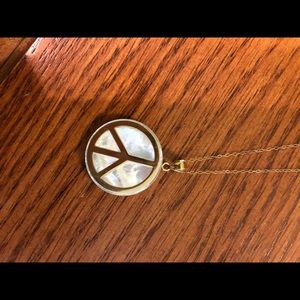 Gold peace necklace and silver heart